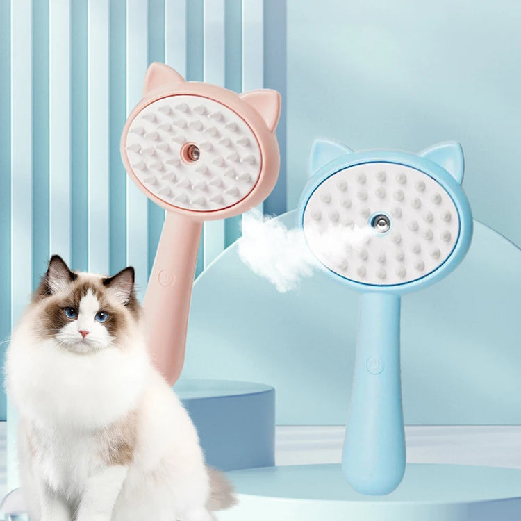 Hair cleaning brush with mist for pet grooming in pink and blue beside a fluffy cat.